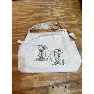 White purse with DC